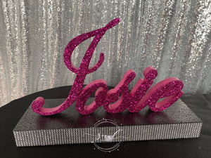 Name centerpiece- script name or block letter with base