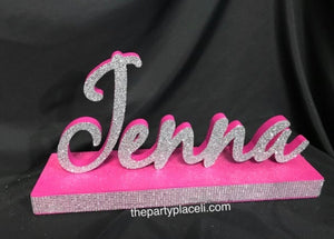 Name centerpiece- script name or block letter with base